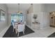Spacious dining area with a table for six, and view to pool at 23176 Lindale Ave, Port Charlotte, FL 33954