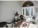 Inviting entryway with wicker chairs and decorative lanterns at 23176 Lindale Ave, Port Charlotte, FL 33954