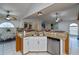 Modern kitchen with granite counters, stainless steel appliances, and white cabinets at 23176 Lindale Ave, Port Charlotte, FL 33954