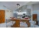 Modern kitchen with white cabinets, granite counters and stainless steel appliances at 23176 Lindale Ave, Port Charlotte, FL 33954