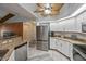 Updated kitchen with granite counters and stainless steel appliances at 23176 Lindale Ave, Port Charlotte, FL 33954