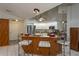 Modern kitchen with stainless steel appliances and breakfast bar at 23176 Lindale Ave, Port Charlotte, FL 33954