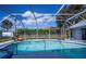 Inviting screened pool with dolphin mosaic at 23176 Lindale Ave, Port Charlotte, FL 33954