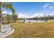 Backyard oasis with pond and lush landscaping at 25017 Lalique Pl, Punta Gorda, FL 33950