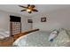 Main bedroom with king-size bed and large TV at 25017 Lalique Pl, Punta Gorda, FL 33950