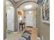Welcoming entryway featuring arched doorways and a calming color scheme at 25017 Lalique Pl, Punta Gorda, FL 33950