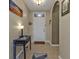 Bright and airy entryway with tile flooring and a console table at 25017 Lalique Pl, Punta Gorda, FL 33950