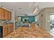 Kitchen island with granite countertop and black appliances at 25017 Lalique Pl, Punta Gorda, FL 33950