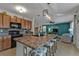 Kitchen island with granite countertop and black appliances at 25017 Lalique Pl, Punta Gorda, FL 33950