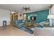 Bright living room with comfy seating and a teal accent wall at 25017 Lalique Pl, Punta Gorda, FL 33950