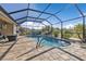 Enclosed kidney-shaped pool with patio at 25017 Lalique Pl, Punta Gorda, FL 33950