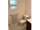 Small bathroom with a toilet, vanity, and shower at 26055 Ancuda Dr, Punta Gorda, FL 33983