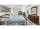 Main bedroom with wooden furnishings and large windows at 26055 Ancuda Dr, Punta Gorda, FL 33983