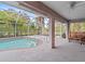 Relaxing screened pool area with patio and seating at 2606 Trilby Ave, North Port, FL 34286