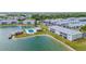 Aerial view of community pool, lakefront property with dock at 3310 Loveland Blvd # 701, Punta Gorda, FL 33980