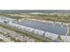 Aerial view of community, lakefront property with numerous buildings at 3310 Loveland Blvd # 701, Punta Gorda, FL 33980