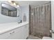 Clean bathroom with white vanity and walk-in shower at 3310 Loveland Blvd # 701, Punta Gorda, FL 33980