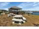 Gazebo with picnic tables and grill overlooking the lake at 3310 Loveland Blvd # 701, Punta Gorda, FL 33980