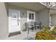 Condo entrance with chairs and landscaping at 3310 Loveland Blvd # 701, Punta Gorda, FL 33980