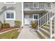 Exterior view of condo building, showing stairs and entrance at 3310 Loveland Blvd # 701, Punta Gorda, FL 33980