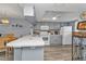 Updated condo kitchen with gray cabinets and island at 3310 Loveland Blvd # 701, Punta Gorda, FL 33980