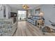 Living room with sliding doors to balcony and lake view at 3310 Loveland Blvd # 701, Punta Gorda, FL 33980