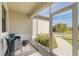 Relaxing screened porch with wicker seating at 3933 Duluth Ter, North Port, FL 34286