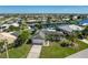 Bird's-eye view of a canal-front home in a residential neighborhood at 414 Norma Ct, Punta Gorda, FL 33950