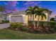 Stunning curb appeal with lush landscaping and two-car garage at 42154 Journey Dr, Punta Gorda, FL 33982