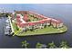 Aerial view of waterfront condo community, showcasing building and boat slips at 1 Colony Point Dr # C3, Punta Gorda, FL 33950