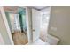 Bathroom with toilet, vanity, and mirrored closet at 1 Colony Point Dr # 3C, Punta Gorda, FL 33950