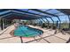 Community pool with covered seating area at 1 Colony Point Dr # C3, Punta Gorda, FL 33950