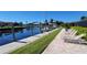 Relaxing waterfront area with lounge chairs and a fire pit at 1 Colony Point Dr # 3C, Punta Gorda, FL 33950