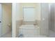 Spa-like bathroom with a soaking tub and separate shower at 1110 Rum Cay Ct, Punta Gorda, FL 33950