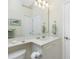 Bathroom with vanity, large mirror, and a corner sink at 1110 Rum Cay Ct, Punta Gorda, FL 33950