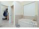 Relaxing bathroom with soaking tub, walk-in shower, and closet at 1110 Rum Cay Ct, Punta Gorda, FL 33950