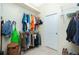 Large walk-in closet with custom shelving and hanging rods at 1110 Rum Cay Ct, Punta Gorda, FL 33950