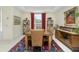 Formal dining room with a wood table, six chairs, and an area rug at 1110 Rum Cay Ct, Punta Gorda, FL 33950