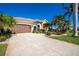 Landscaped property featuring a large driveway and a two-car garage at 1110 Rum Cay Ct, Punta Gorda, FL 33950