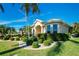 Landscaped front yard of a single-story house with a circular driveway at 1110 Rum Cay Ct, Punta Gorda, FL 33950