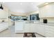 Bright kitchen with white cabinets and granite countertops at 1110 Rum Cay Ct, Punta Gorda, FL 33950