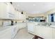 Bright kitchen with white cabinets and granite countertops at 1110 Rum Cay Ct, Punta Gorda, FL 33950