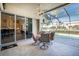 Covered patio with table and chairs, overlooking the pool at 1110 Rum Cay Ct, Punta Gorda, FL 33950