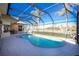 Inviting kidney-shaped pool with screened enclosure at 1110 Rum Cay Ct, Punta Gorda, FL 33950