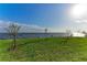 Waterfront backyard with young trees and grassy area at 112 Northshore Ter, Punta Gorda, FL 33980