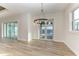 Bright dining room with chandelier and sliding glass doors leading to a patio at 112 Northshore Ter, Punta Gorda, FL 33980