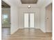 Bright and airy entryway with wood-look tile floors at 112 Northshore Ter, Punta Gorda, FL 33980