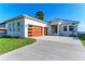 Modern home with a two-car garage and a waterfront view at 112 Northshore Ter, Punta Gorda, FL 33980