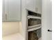 Stainless steel double oven with microwave installed in modern kitchen cabinetry at 112 Northshore Ter, Punta Gorda, FL 33980