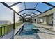 Inviting screened pool and spa overlooking the water at 112 Northshore Ter, Punta Gorda, FL 33980